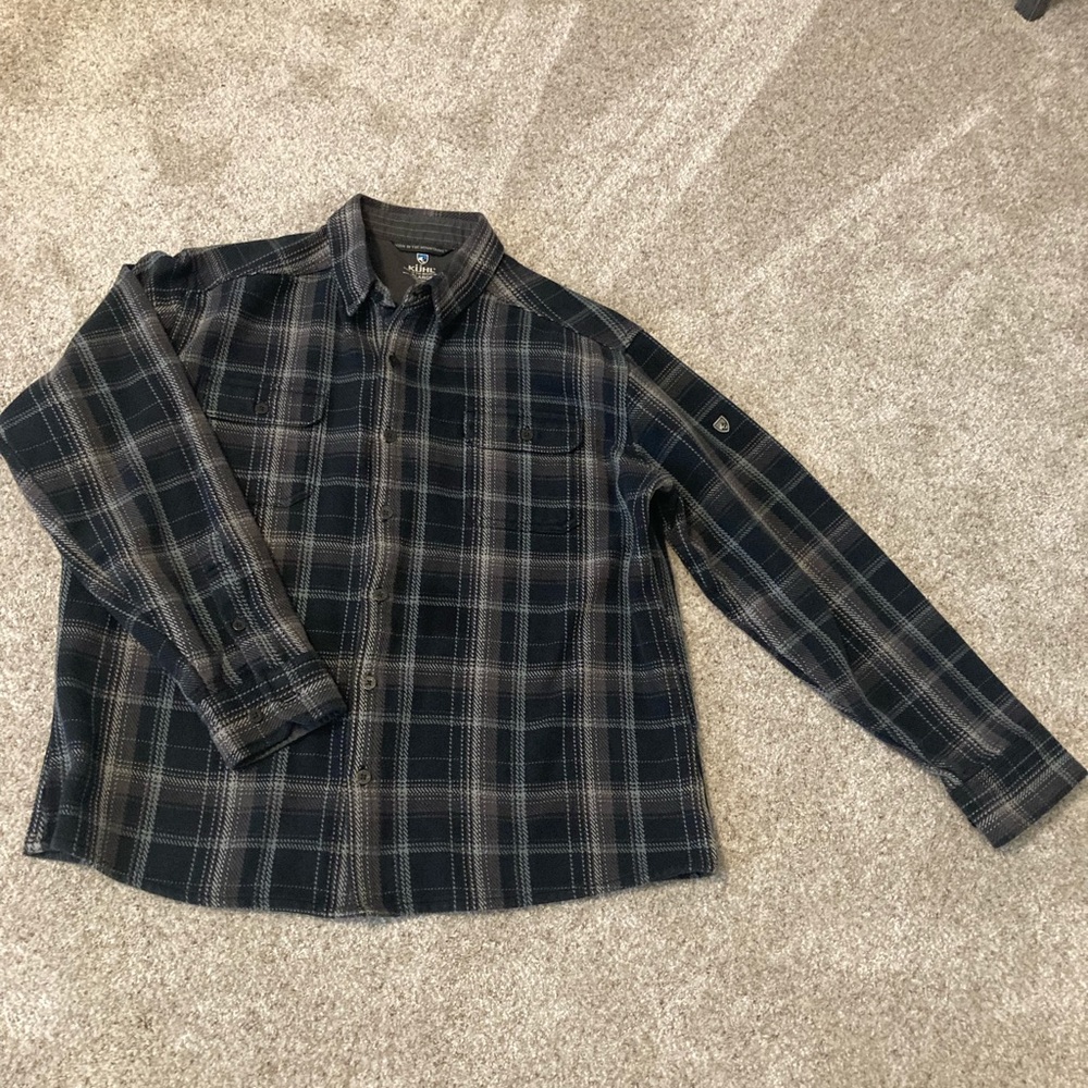 Kuhl button front shirt fits more like a large than XL.